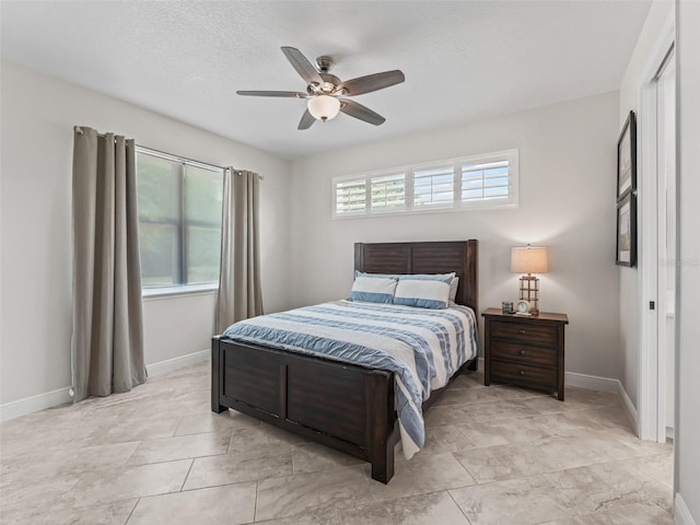 563 Dowling Cir, Lady Lake, FL 32159 - bedroom featuring baseboards and ceiling fan