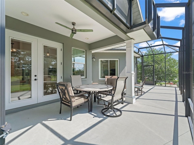 563 Dowling Cir, Lady Lake, FL 32159 - view of patio / terrace featuring french doors, a ceiling fan, outdoor dining space, and a lanai