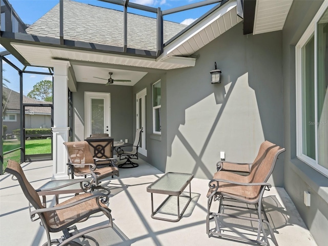 563 Dowling Cir, Lady Lake, FL 32159 - view of patio featuring a ceiling fan and a lanai