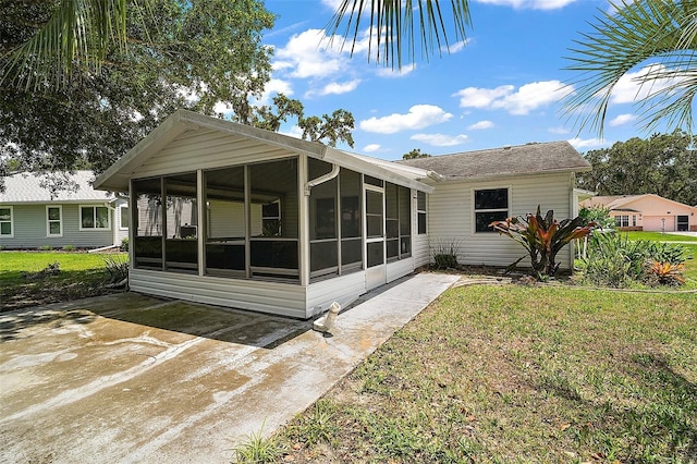 5618 Rosewall Cir, Leesburg, FL 34748 - rear view of property featuring a sunroom and a yard