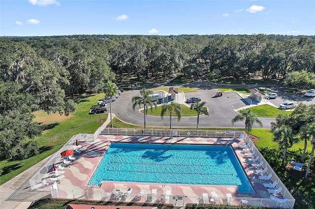 5618 Rosewall Cir, Leesburg, FL 34748 - drone / aerial view of a pool and a heavily wooded area