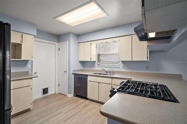 5618 Rosewall Cir, Leesburg, FL 34748 - kitchen featuring dishwashing machine, light wood-style floors, light brown cabinets, a sink, and cooktop