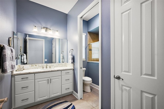 4033 Swaying Palm Ct, The Villages, FL 32163 - bathroom featuring vanity, toilet, tile patterned flooring, a shower with shower door, and baseboards