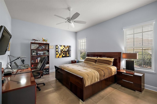 4033 Swaying Palm Ct, The Villages, FL 32163 - bedroom with an office area, baseboards, light tile patterned flooring, and a ceiling fan