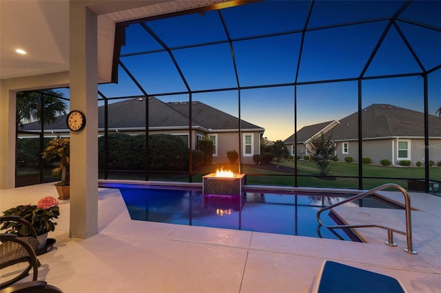 4033 Swaying Palm Ct, The Villages, FL 32163 - pool at dusk featuring an outdoor pool, a patio area, and glass enclosure