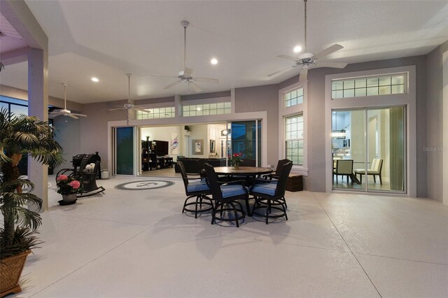 4033 Swaying Palm Ct, The Villages, FL 32163 - dining space featuring recessed lighting, a ceiling fan, finished concrete floors, and a towering ceiling