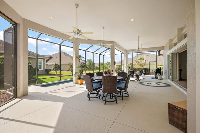 4033 Swaying Palm Ct, The Villages, FL 32163 - sunroom / solarium featuring outdoor dining space, a ceiling fan, and a residential view