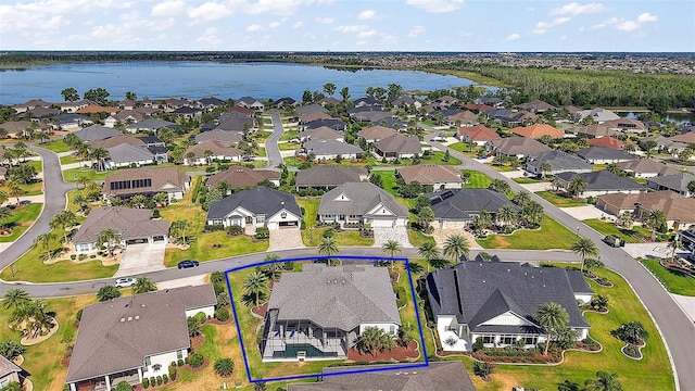 4033 Swaying Palm Ct, The Villages, FL 32163 - aerial view of residential area with a nearby body of water and property parcel outlined