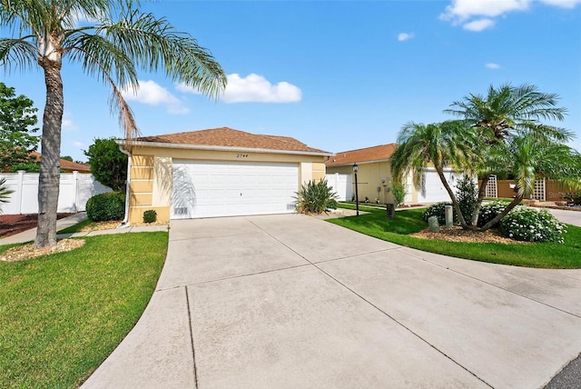 2744 Gresham Ave, The Villages, FL 32162 - ranch-style house featuring concrete driveway, stucco siding, and an attached garage
