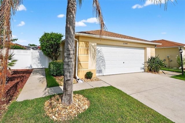 2744 Gresham Ave, The Villages, FL 32162 - view of front of home with stucco siding