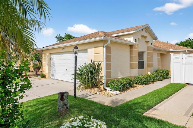 2744 Gresham Ave, The Villages, FL 32162 - view of home's exterior featuring stucco siding, concrete driveway, a garage, and roof with shingles