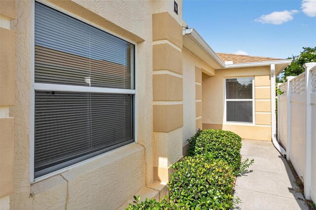 2744 Gresham Ave, The Villages, FL 32162 - doorway to property with stucco siding