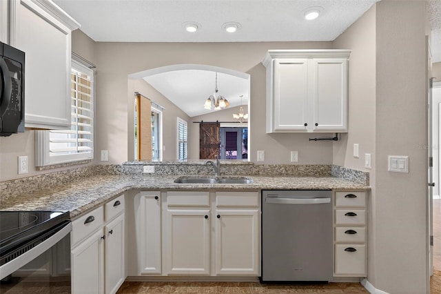 2744 Gresham Ave, The Villages, FL 32162 - kitchen with black appliances, a sink, a chandelier, arched walkways, and vaulted ceiling