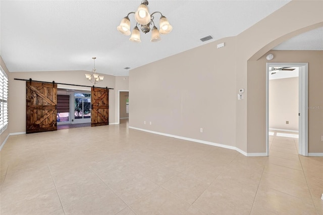 2744 Gresham Ave, The Villages, FL 32162 - unfurnished living room featuring a chandelier, a barn door, arched walkways, light tile patterned floors, and vaulted ceiling