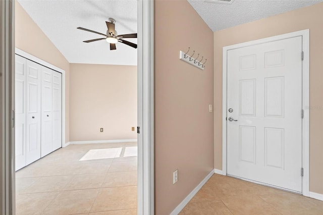 2744 Gresham Ave, The Villages, FL 32162 - interior space with a ceiling fan, light tile patterned flooring, a textured ceiling, and baseboards