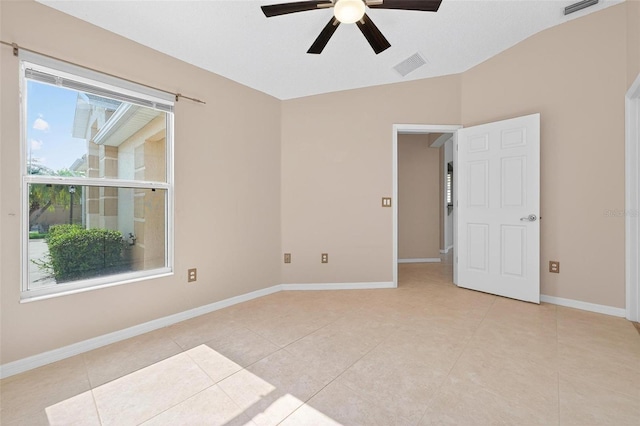 2744 Gresham Ave, The Villages, FL 32162 - unfurnished room featuring healthy amount of natural light, a ceiling fan, light tile patterned floors, and vaulted ceiling