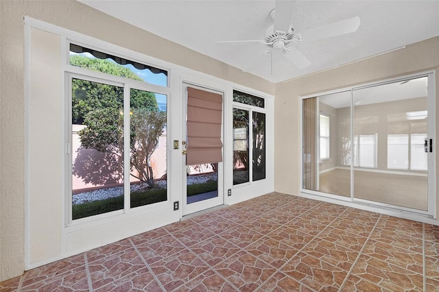 2744 Gresham Ave, The Villages, FL 32162 - unfurnished sunroom with stone flooring