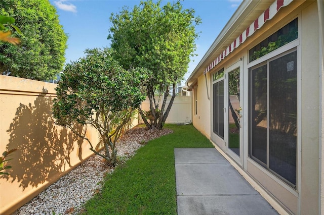 2744 Gresham Ave, The Villages, FL 32162 - fenced backyard featuring a patio