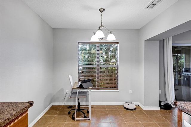 dining room featuring tile patterned floors, a chandelier, and baseboards