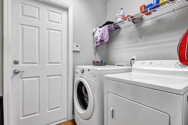 laundry area with washing machine and dryer