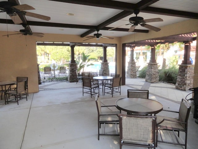 view of patio / terrace with a ceiling fan and outdoor dining area