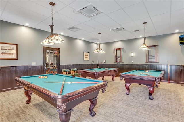 recreation room with pool table, a wainscoted wall, carpet floors, a drop ceiling, and wooden walls