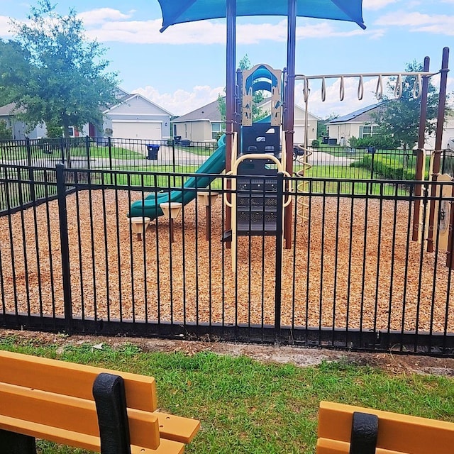 2106 Elio Ridge Dr, Zellwood, FL 32798 - view of playground featuring fence and a residential view