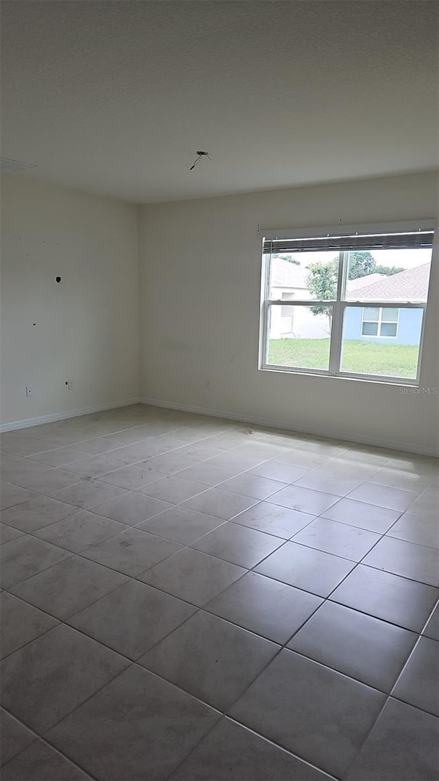 2106 Elio Ridge Dr, Zellwood, FL 32798 - unfurnished room with tile patterned floors and baseboards