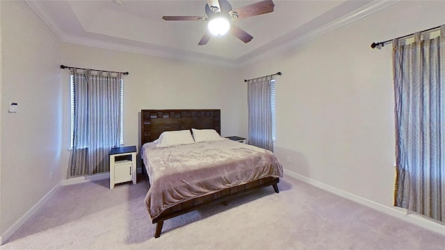 108 Whispering Pines Way, Davenport, FL 33837 - carpeted bedroom featuring baseboards, ornamental molding, a ceiling fan, and a tray ceiling