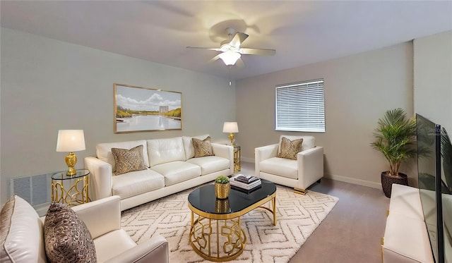 108 Whispering Pines Way, Davenport, FL 33837 - carpeted living room featuring a ceiling fan and baseboards