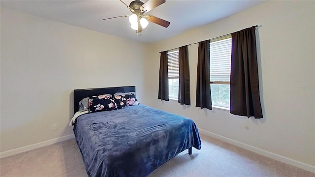 108 Whispering Pines Way, Davenport, FL 33837 - bedroom with carpet floors, baseboards, and a ceiling fan
