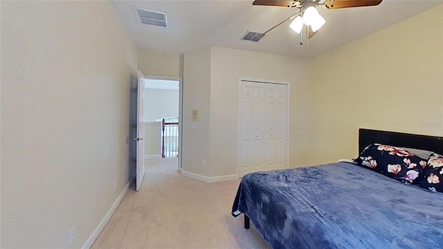 108 Whispering Pines Way, Davenport, FL 33837 - bedroom with light carpet, baseboards, ceiling fan, and a closet