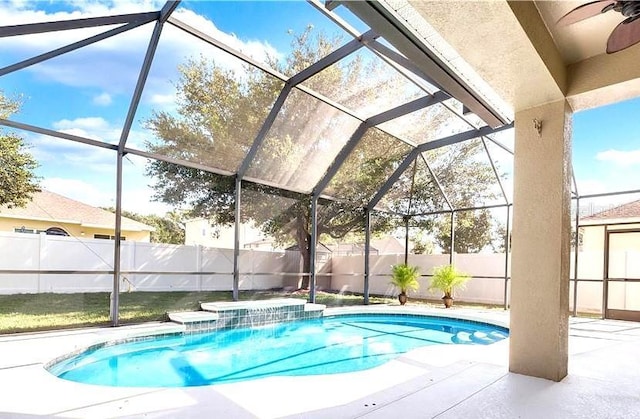 108 Whispering Pines Way, Davenport, FL 33837 - view of swimming pool with a fenced backyard, a ceiling fan, a patio area, and glass enclosure