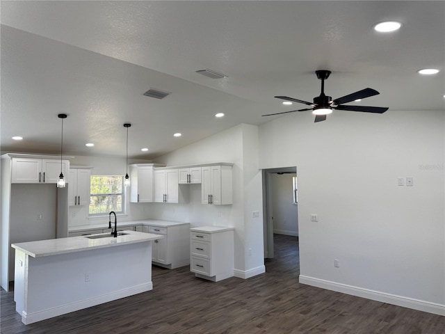 2 Pine Terrace Way, Ocala, FL 34472 - kitchen with a sink, an island with sink, dark wood-style floors, white cabinets, and recessed lighting