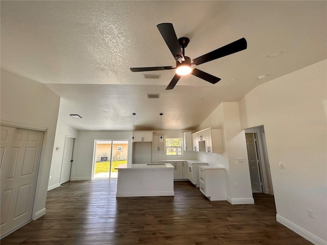 2 Pine Terrace Way, Ocala, FL 34472 - kitchen featuring vaulted ceiling, a kitchen island, white cabinetry, ceiling fan, and dark wood finished floors