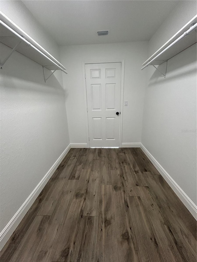 2 Pine Terrace Way, Ocala, FL 34472 - walk in closet with dark wood-style floors
