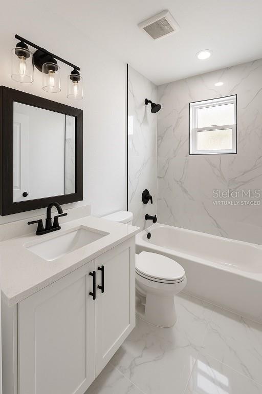 2 Pine Terrace Way, Ocala, FL 34472 - full bathroom featuring vanity, toilet, tub / shower combination, and marble finish floors