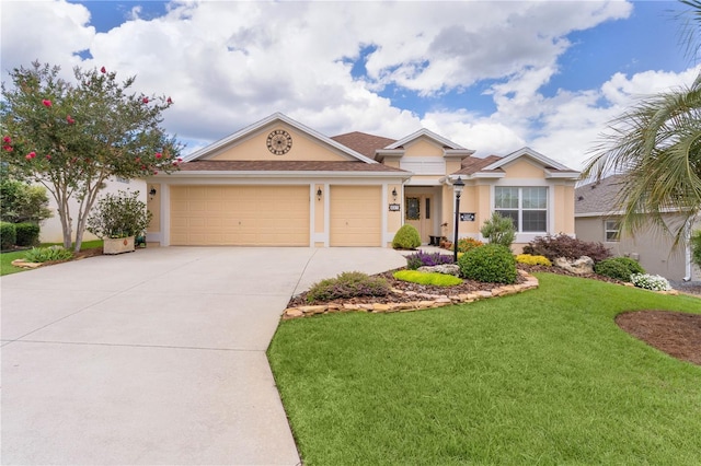 627 Leeds Pl, The Villages, FL 32162 - ranch-style home featuring concrete driveway, stucco siding, a front yard, and an attached garage