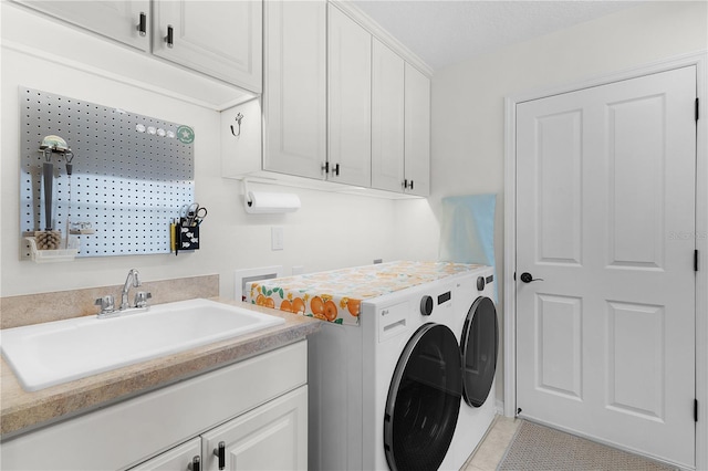 627 Leeds Pl, The Villages, FL 32162 - laundry area with cabinet space, independent washer and dryer, and light tile patterned floors