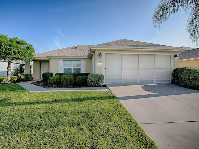 8601 SE 133rd St, Summerfield, FL 34491 - ranch-style house with concrete driveway, stucco siding, an attached garage, a front yard, and roof with shingles