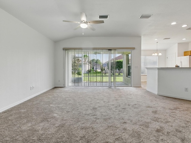 8601 SE 133rd St, Summerfield, FL 34491 - unfurnished living room featuring vaulted ceiling, baseboards, ceiling fan, light colored carpet, and recessed lighting