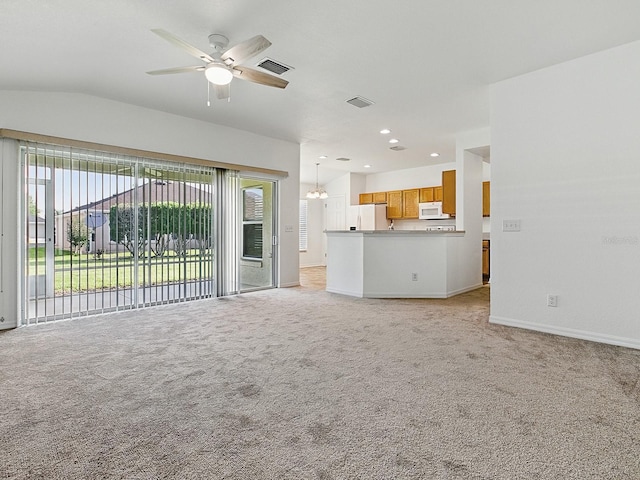 8601 SE 133rd St, Summerfield, FL 34491 - unfurnished living room with a ceiling fan, light carpet, baseboards, recessed lighting, and vaulted ceiling