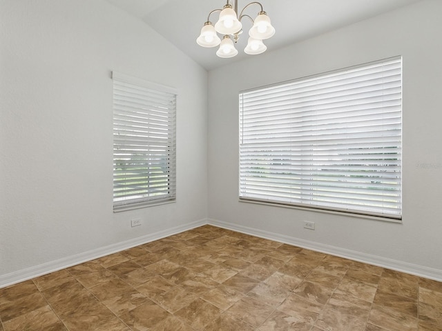 8601 SE 133rd St, Summerfield, FL 34491 - spare room with a chandelier, lofted ceiling, and baseboards
