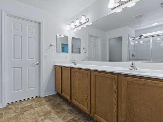 8601 SE 133rd St, Summerfield, FL 34491 - bathroom with a shower stall, double vanity, and baseboards