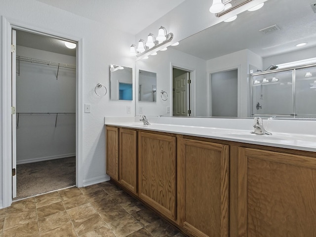 8601 SE 133rd St, Summerfield, FL 34491 - full bath with a stall shower, double vanity, a spacious closet, and baseboards