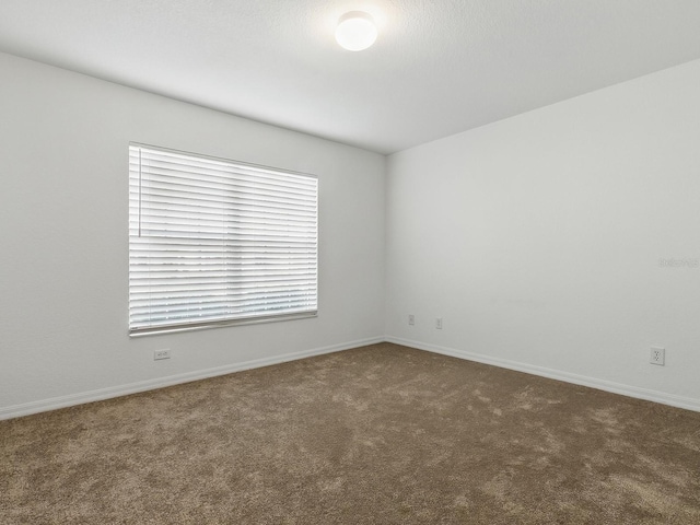 8601 SE 133rd St, Summerfield, FL 34491 - carpeted empty room featuring baseboards
