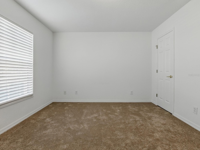 8601 SE 133rd St, Summerfield, FL 34491 - carpeted spare room featuring baseboards and plenty of natural light