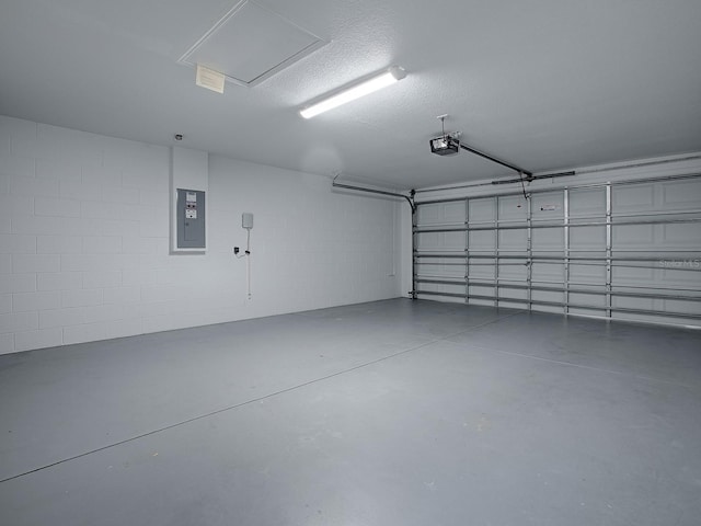 8601 SE 133rd St, Summerfield, FL 34491 - garage with a garage door opener, electric panel, and concrete block wall