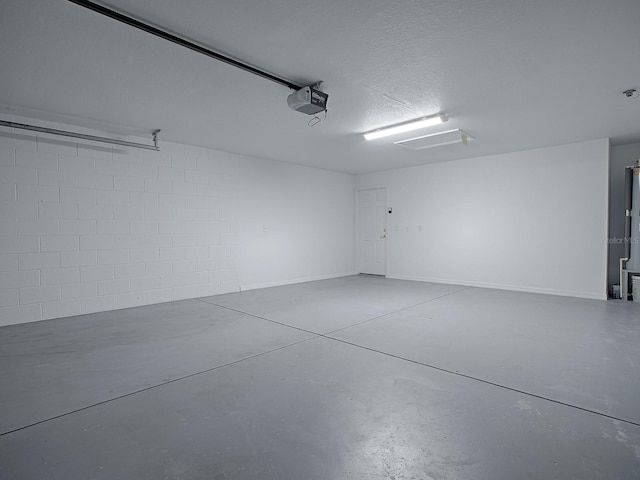 8601 SE 133rd St, Summerfield, FL 34491 - garage with a garage door opener and concrete block wall