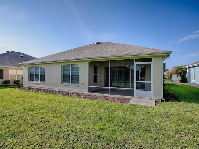 8601 SE 133rd St, Summerfield, FL 34491 - rear view of house with a sunroom, a lawn, and stucco siding